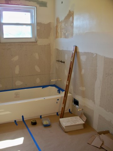 Getting there. Protect the tub and floor